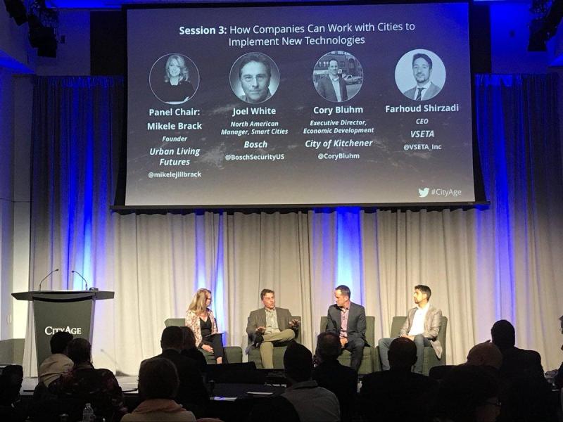 Farhoud Shirzadi speaking at CityAge Mars on Smart Cities and PropTech (wide shot)